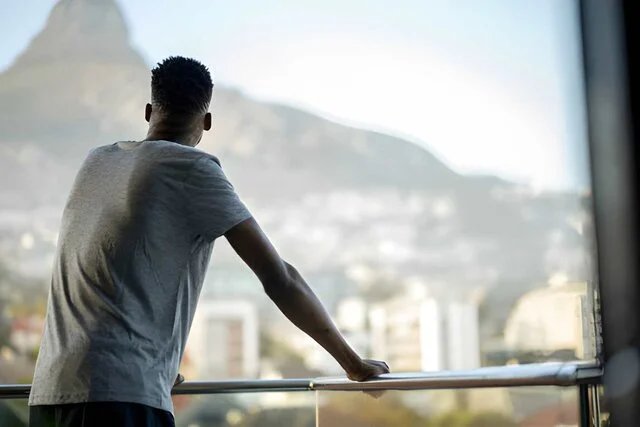 looking out the window feeling successful and absolute financial freedom