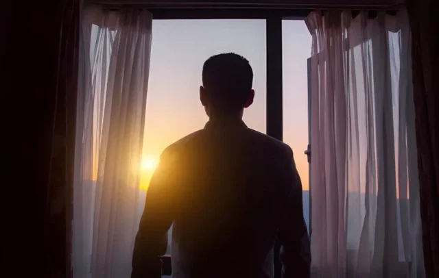 standing guard at the window